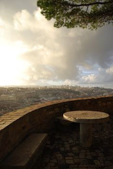 stone picnic table with a gorgeous view over Lisbon, Portugal