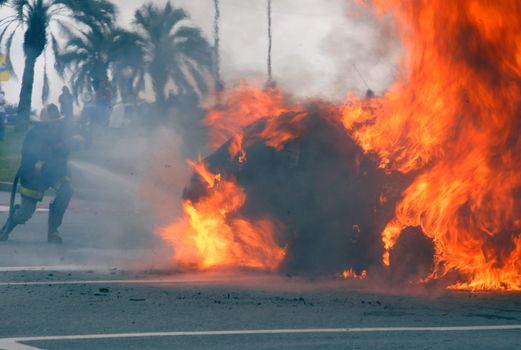 Car fire being extinguished Montevideo, Uruguay.