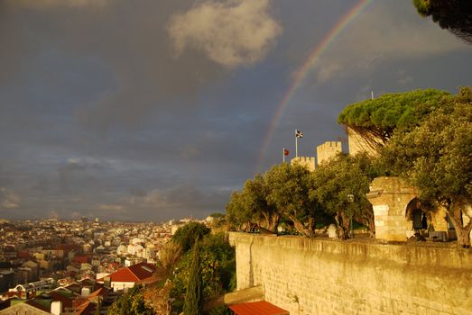 rainbow over Castelo Sao Jorge and the city of Lisbon underneath