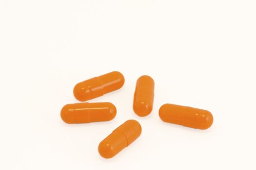 Vitamin pills on isolated white