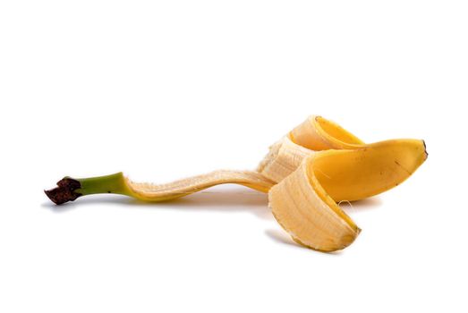 Peeled bitten banana. Ripe fruit isolated on white background