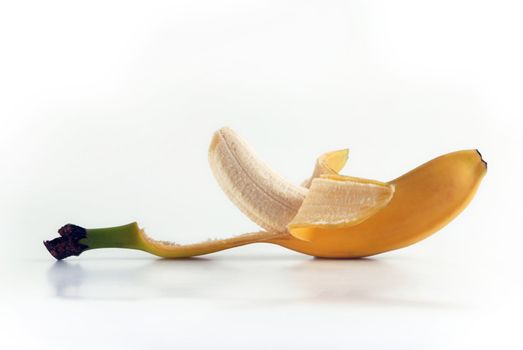 Peeled banana. Ripe fruit isolated on white background