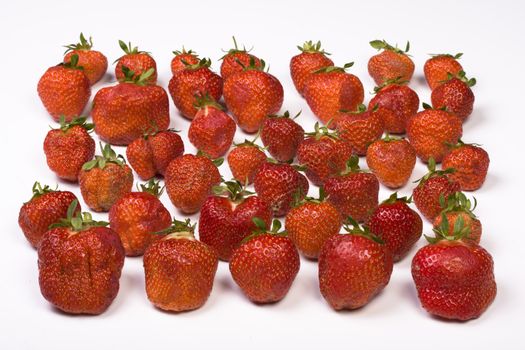 a lot of strawberries on white background