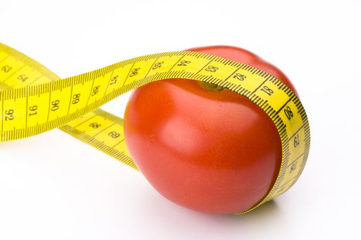 measuring tape and a tomato