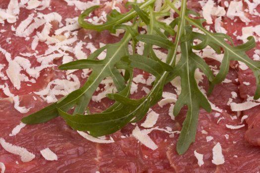 beef carpaccio with rocket salad