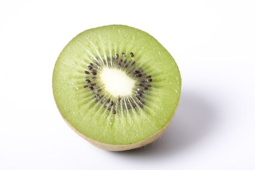 a detail of a kiwi fruit on white background