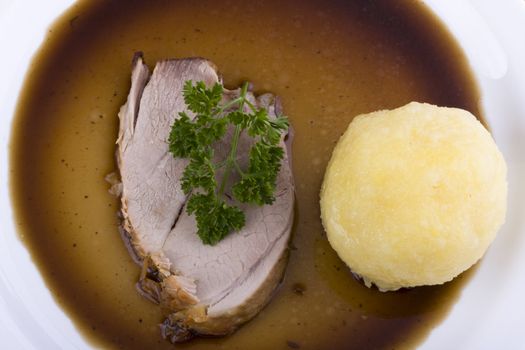 bavarian roast pork dish with potato dumpling