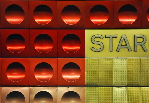 Red and golden circled metal texture with the word star.