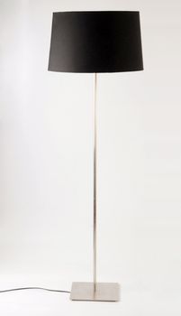 Contemporary black and metallic floor lamp. Isolated on white 