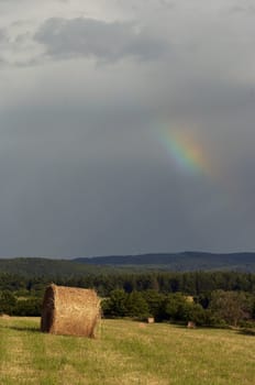 Shot of the dark sky with rainbow - after rain