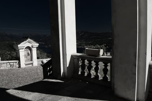 Monochromatic view of Church colonnade and chapel (Madonna del Sasso, Italy)