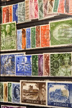 Diverse and colorful vintage postage stamps of United Kingdom. Old collection.
