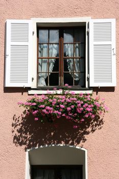 Beautiful, decorative window with flowers in Feldkirch, Vorarlberg, Austria