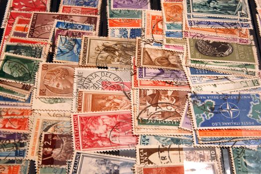 Diverse and colorful vintage postage stamps from Italy. 
