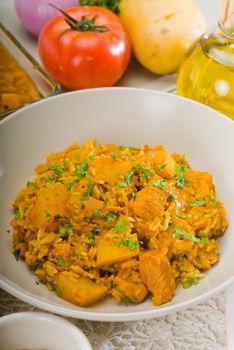 fresh home made curry beef rice and potatoes with ingredients around composition