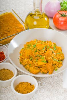 fresh home made curry beef rice and potatoes with ingredients around composition