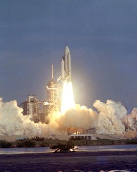 The Space Shuttle rises majestically above Launch Complex 39's Pad A on the first leg of its maiden journey into space. On board for the historic flight are astronauts John Young and Bob Crippen, scheduled to spend nearly 54 hours in space on this first shakedown test of Americas's new reusable Space Transportation System (STS). The Sunday morning liftoff came a few seconds after 7:00 a.m. Photo taken: 04/12/1981. ** Credit: NASA / yaymicro.com **