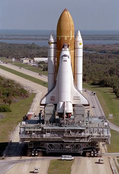 The Space Shuttle Discovery completes the final Earth-bound portion of its journey into space, leaving the Vehicle Assembly Building on the slow trip to Launch Pad 39B. Discovery is scheduled to fly the first Shuttle mission of 1995, STS-63, in early February. Photo taken: 01/10/1995. ** Credit: NASA / yaymicro.com **