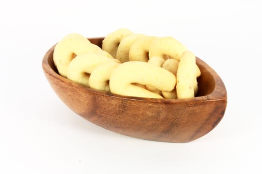 Homemade cakes with coconut meal in a bowl isolated on white