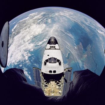 Fish-eye view of the Space Shuttle Atlantis as seen from the Russian Mir space station during the STS-71 mission. ** Credit: NASA / yaymicro.com **