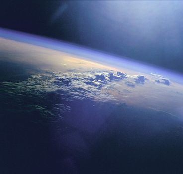 Clouds and sunglint as seen during the STS-96 mission from the Space Shuttle Discovery. ** Credit: NASA / yaymicro.com **