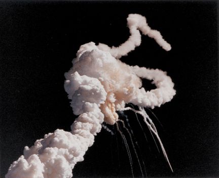 On January 28, 1986, the Space Shuttle Challenger and her seven-member crew were lost when a ruptured O-ring in the right Solid Rocket Booster caused an explosion soon after launch. This photograph, taken a few seconds after the accident, shows the Space Shuttle Main Engines and Solid Rocket Booster exhaust plumes entwined around a ball of gas from the External Tank. Because shuttle launches had become almost routine after fifty successful missions, those watching the shuttle launch in person and on television found the sight of the explosion especially shocking and difficult to believe until NASA confirmed the accident. Photo taken: 01/28/1986. ** Credit: NASA / yaymicro.com **