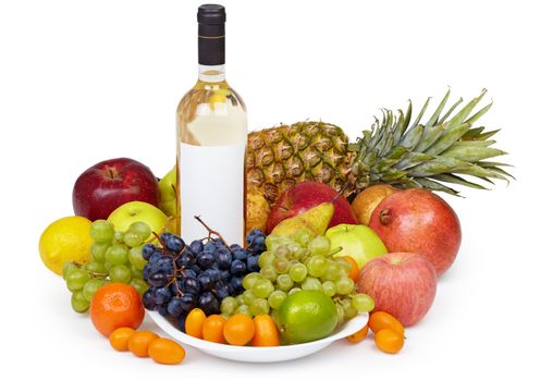 Still life of tropical fruits and bottle of wine on white