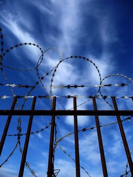 A gate with Razorwire for security concepts.