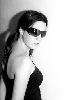 girl fashion glasses over black background