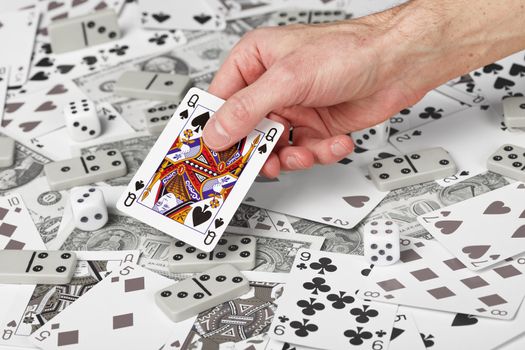 The Queen of Spades in the men's hand