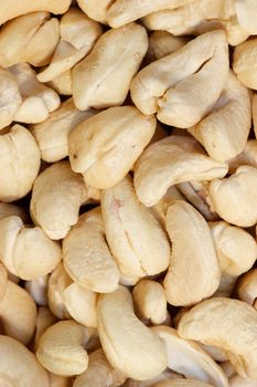 Dried cashew nuts close-up background