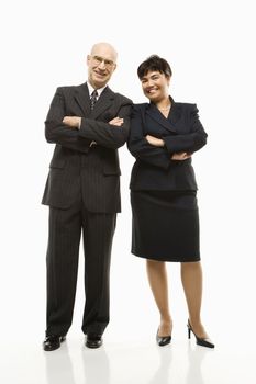 Smiling Caucasian middle-aged businessman and Filipino businesswoman standing with arms crossed against white background.