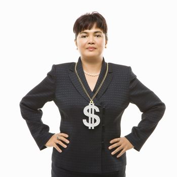 Filipino middle-aged businesswoman wearing chain necklace with oversized dollar sign.