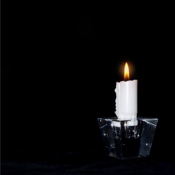 Candle in the dark lit for: • peace • love • understanding • the world • you and me The black background is ideal for your own text, and as it is 100% pure black you can simply add all the space you want on any side of the candle.