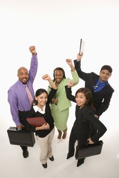 Portrait of multi-ethnic business group standing holding briefcases and cheering.