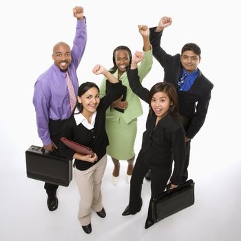 Portrait of multi-ethnic business group standing holding briefcases and cheering.