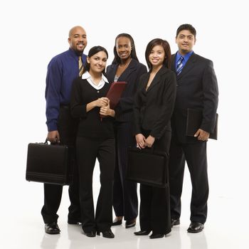 Multi-ethnic business group of men and women standing with briefcases looking at viewer.