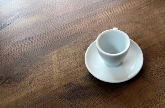 empty cup on wood floor