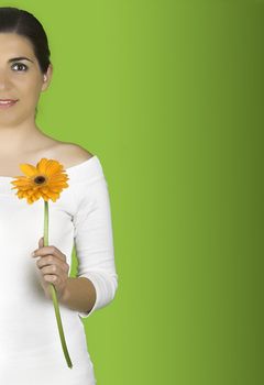 Beautiful woman with flowers on a green background