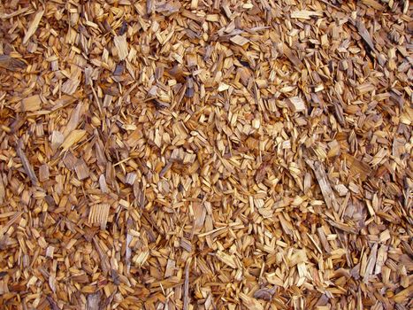 Wood Chips - Mulch used as protective cover over the soil in a garden. A good illustration for gardeners, architects, environment planning, etc., but also useful as an effectful grungy background for high end design products and other exclusive stuff as a contrast to clean modern lines and curves.