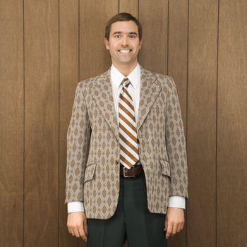 Portrait of smiling mid-adult Caucasian male in retro suit