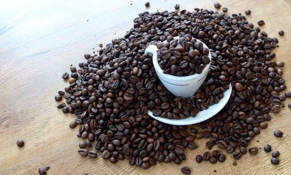 a cup of coffee on wood floor