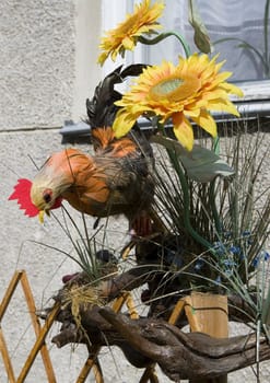 The cock on a fence