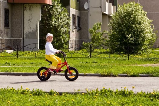 Picture of my daughter going for a drive a bicycle