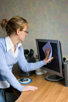 The image of the girl wiping the monitor