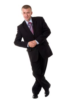 smiling young businessman standing against isolated white background