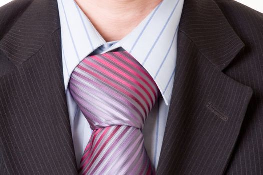 Closeup of a business man. Necktie and suit.