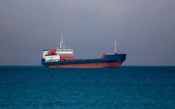 nave on roadstead before storm on sea