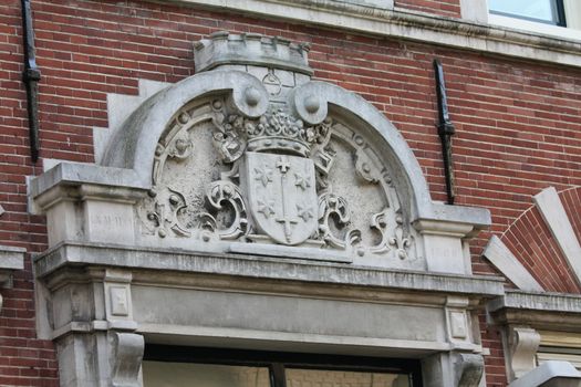 Plaque on a facade with the coat of arms of the city of Haarlem