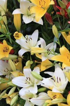 floral arrangement made off yellow and white tigerlilies